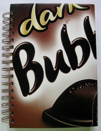 Recycled poster notebook made from a Cadbury bubbly chocolate campaign